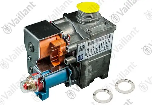 Vaillant Gasarmatur mit metallischem Gehäuse, Anschlüssen und einer gelben Abdeckung. Zwei Ablagescheiben befinden sich im Bild.